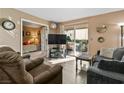 Comfortable living room with sliding door to balcony with neutral color scheme at 3550 Bay Sands Dr # 1003, Laughlin, NV 89029