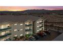 Condo building featuring balconies with stylish railings, set against a backdrop of mountains and desert landscape at 3550 Bay Sands Dr # 2101, Laughlin, NV 89029