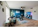 Spacious living room featuring large windows, plush seating, and modern decor for comfortable living at 3789 Heritage Ave, Las Vegas, NV 89121