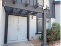 Charming two-story home with a covered entrance and tidy landscaping at 4016 Edgeford Pl, Las Vegas, NV 89102