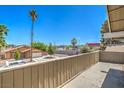 Exterior shot from the balcony offering views of the neighborhood and palm trees at 4889 W Montara Cir, Las Vegas, NV 89121
