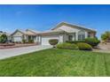 Beautiful single-story house featuring a well-kept lawn and long driveway at 4924 Cedar Lawn Way, Las Vegas, NV 89130