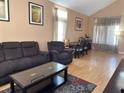 This well lit living room has vaulted ceilings, and features a sofa and table with seating at 5255 Autumn Sky Rd, Las Vegas, NV 89118