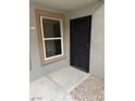 Secured front door with decorative iron gate and adjacent window for natural light at 555 E Silverado Ranch Blvd # 1034, Las Vegas, NV 89183