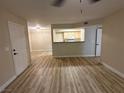 Spacious living room with wood-look flooring and a view of the kitchen at 555 E Silverado Ranch Blvd # 1034, Las Vegas, NV 89183