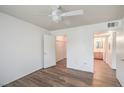 Bright bedroom with a ceiling fan, walk-in closet, and en suite bathroom at 5710 E Tropicana Ave # 1017, Las Vegas, NV 89122