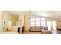Bright living room with high ceilings, fireplace, and large windows for plenty of natural light at 5900 Red Umber Ave, Las Vegas, NV 89130
