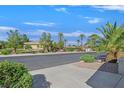 Street view of a beautiful community with mature trees and landscaping at 6001 Falconer Ave, Las Vegas, NV 89122