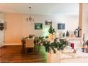 Dining area featuring table set for six with neutral wall art and open to the kitchen at 8324 W Charleston Blvd # 1036, Las Vegas, NV 89117