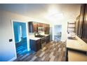 Charming kitchen featuring stainless steel appliances, wood cabinets, and luxury vinyl flooring at 9000 Litchfield Ave, Las Vegas, NV 89134