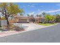 Beautiful single-story home featuring desert landscaping, a two-car garage, and convenient community mailboxes at 10089 Clifton Forge Ave, Las Vegas, NV 89148