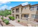 Multi-level townhome with private balconies and well-manicured landscaping at 1525 Spiced Wine Ave # 14105, Henderson, NV 89074