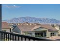 Scenic mountain views from a residential community with tile roofs and desert landscaping at 168 Robledo St, Las Vegas, NV 89138
