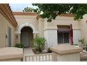 Warm and welcoming front entrance with well-manicured garden and stylish security door at 2013 Capestone St, Las Vegas, NV 89134