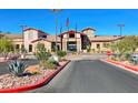 Stunning exterior of the clubhouse featuring well manicured landscaping, desert plants and a circular drive at 2056 Oliver Springs St, Henderson, NV 89052