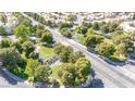 Scenic community lake surrounded by mature trees, lush greenery, and neighborhood streets at 2708 Norbeck St, Las Vegas, NV 89117