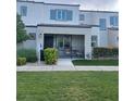 Charming townhome featuring a covered porch, well-maintained lawn, and inviting curb appeal at 3534 Alpheus River Ave, Las Vegas, NV 89106