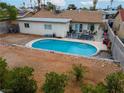 Aerial view of the backyard featuring a sparkling in-ground pool and spacious patio area at 3661 Margarita Way, Las Vegas, NV 89103