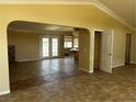 Spacious living room featuring a fireplace and access to the backyard through double glass doors at 3750 S Rainbow Ave, Pahrump, NV 89048