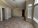 Bright living room featuring tiled floors and a large window, creating a comfortable space at 3750 S Rainbow Ave, Pahrump, NV 89048
