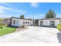 Well-maintained one-story home with a long driveway and desert-friendly landscaping at 3805 San Angelo Ave, Las Vegas, NV 89102