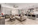 Spacious open-concept living room and kitchen featuring modern decor and ample natural light at 39 Castleton Tower Ct, Henderson, NV 89011