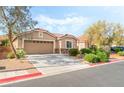 Charming single-story home with a well-manicured lawn and inviting curb appeal at 4329 Skimmers Ct, North Las Vegas, NV 89084