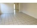 Bright living room with clean tile flooring, neutral walls, and an open layout at 5436 Burkshire Dr, Las Vegas, NV 89142