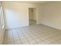 Bright living room with clean tile flooring, neutral walls, and an open layout at 5436 Burkshire Dr, Las Vegas, NV 89142