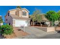 Inviting two-story home with a spacious driveway, mature landscaping, and a desirable location, ideal for comfortable living at 5466 Silverheart Ave, Las Vegas, NV 89142