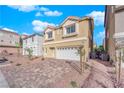Inviting two-story home featuring a two-car garage and desert landscaping in front at 6142 Kelson Creek Ct, Las Vegas, NV 89118