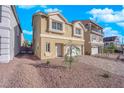 Inviting two-story home featuring a two-car garage and desert landscaping in front at 6142 Kelson Creek Ct, Las Vegas, NV 89118