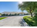 Inviting single story house featuring a long circular driveway with a well-manicured lawn at 6419 Eldora Ave, Las Vegas, NV 89146