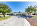 Attractive single-story home featuring a circular driveway and well-maintained front yard at 6419 Eldora Ave, Las Vegas, NV 89146