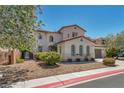 Charming two-story home with landscaped front yard and beautiful flowering tree at 6424 Grayback Dr, North Las Vegas, NV 89084