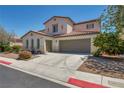 Two-story home with a two-car garage, neutral palette and low-maintenance landscaping at 6424 Grayback Dr, North Las Vegas, NV 89084