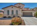 Well-maintained two-story home with two-car garage and arched windows at 6424 Grayback Dr, North Las Vegas, NV 89084