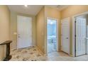 Hallway view with access to multiple rooms, featuring a tiled floor and neutral color scheme at , Henderson, NV 89044