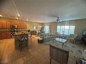 Open floor plan with a kitchen featuring stainless steel appliances that connects to the living area at , Henderson, NV 89044