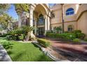 Grand home exterior with meticulously manicured landscaping and impressive architectural details at 1008 Trophy Hills Dr, Las Vegas, NV 89134