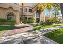 Stately home showcasing lush landscaping and a welcoming circular driveway at 1008 Trophy Hills Dr, Las Vegas, NV 89134