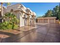 Spacious garages with ample parking and a well-maintained driveway at 1008 Trophy Hills Dr, Las Vegas, NV 89134