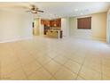 Spacious living room with tiled floors leading into the kitchen, ideal for gatherings at 10331 Northern Hills Ave, Las Vegas, NV 89166