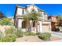 Charming two-story home with a terracotta roof, two-car garage, and covered front porch at 11900 Calle De Sol Dr, Las Vegas, NV 89138