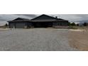 Charming single-story home with gravel front yard and attached two-car garage at 1830 Justine Ct, Pahrump, NV 89048