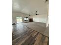 Spacious living room with carpet, a fireplace, and access to the backyard at 1830 Justine Ct, Pahrump, NV 89048