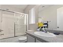 Bright bathroom with a shower, vanity, and tiled floors, creating a clean and functional space at 2272 Platinum Band St, Las Vegas, NV 89156