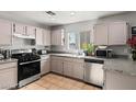 Functional kitchen featuring stainless steel appliances, granite countertops, and ample cabinet space at 2272 Platinum Band St, Las Vegas, NV 89156