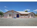 Charming single story home with a well-maintained gravel yard and welcoming front porch, number 2650 visible at 2650 Sagebrush Ave, Pahrump, NV 89048
