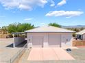 Spacious detached two car garage with extended carport, offering ample parking and storage solutions at 2650 Sagebrush Ave, Pahrump, NV 89048